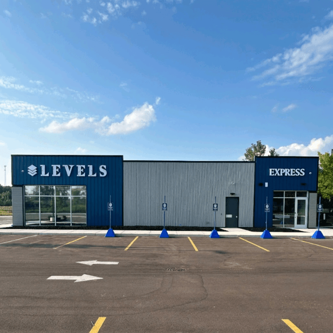 Levels Cannabis – Trusted Michigan Cannabis Dispensary Exterior view of Levels Cannabis retail location in Michigan, showcasing the building and brand signage.